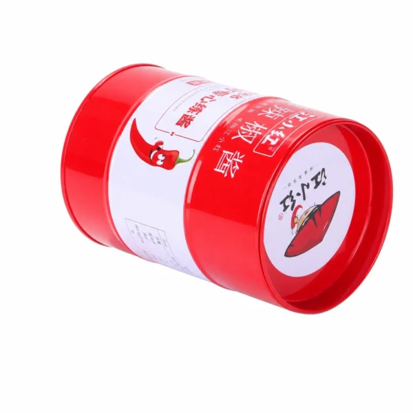 Foto do produto da caixa de lata personalizada para chá em formato cilíndrico vermelha, produzida pela JIAMU Packaging